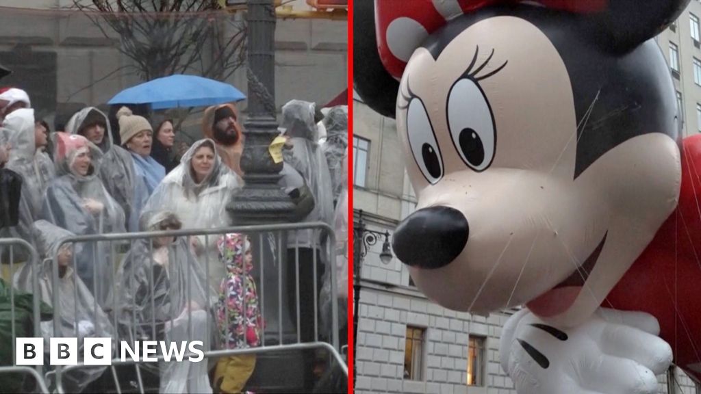 Macy’s 100th Thanksgiving parade marches on despite the rain in New York City