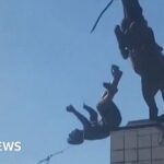 Statue of Syrian president's brother is torn down in Aleppo