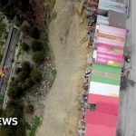 Bolivian shamans refuse to leave shacks on deadly cliff edge