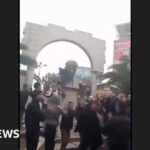 Statue of Bashar al-Assad's father toppled in Damascus suburb