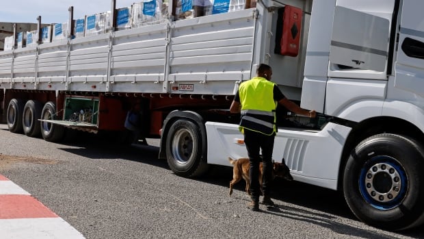 UN halts aid shipments through Gaza’s main crossing after looting