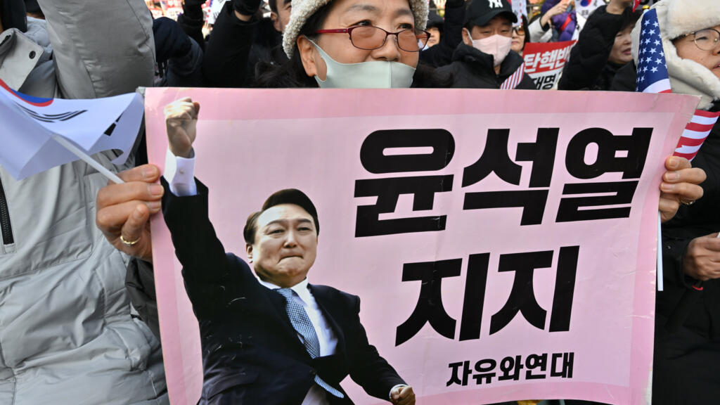 South Korea's impeached president Yoon defies arrest over failed martial law bid