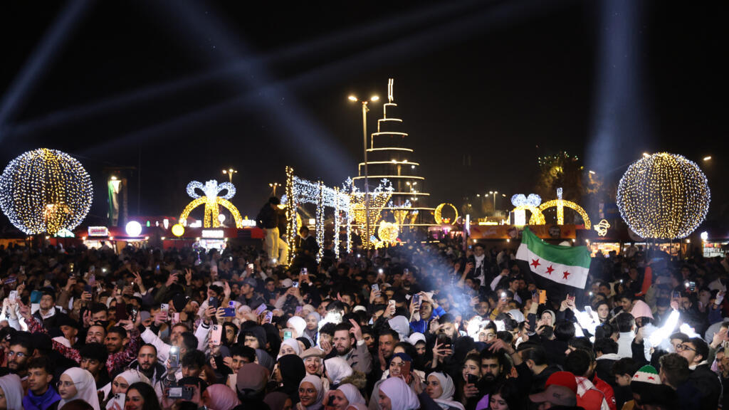 Throngs of Syrians celebrate new year in a Damascus freed from Assad